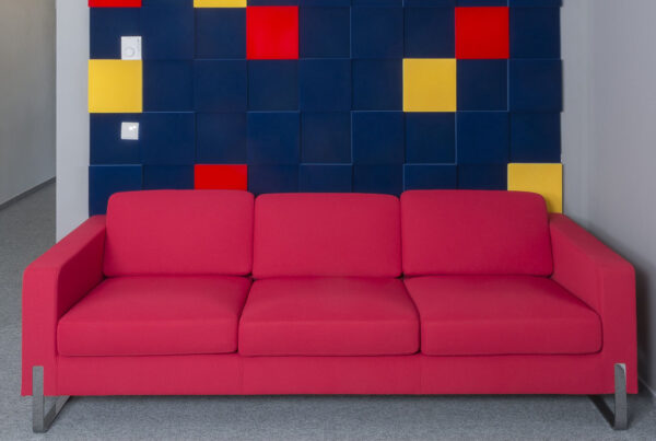 Example of bespoke office interior design with soft seating and wall panels