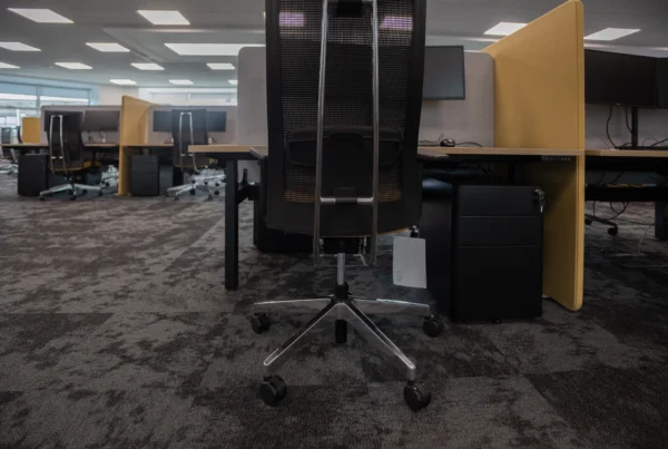 Office ergonomics with an ergonomic office chair and ergonomic workstation in a modern office